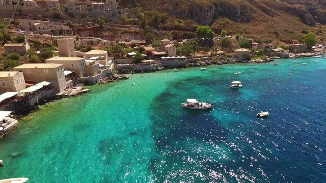 Aerial drone video of picturesque village of Limeni with clear waters, Mani, Peloponnese, Greece