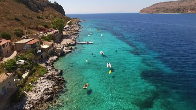 Aerial drone video of picturesque village of Limeni with clear waters, Mani, Peloponnese, Greece