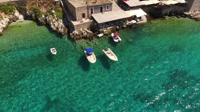 Aerial drone video of picturesque village of Limeni with clear waters, Mani, Peloponnese, Greece