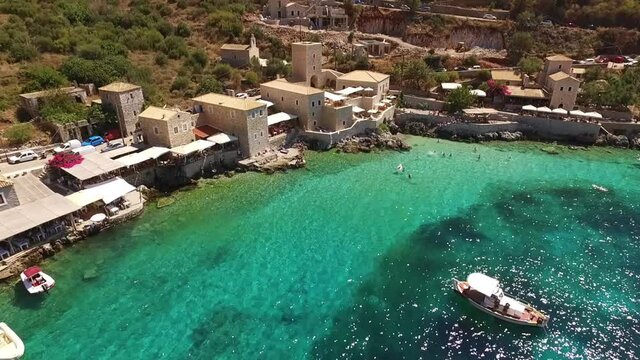 Aerial drone video of picturesque village of Limeni with clear waters, Mani, Peloponnese, Greece