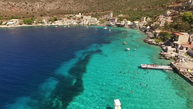 Aerial drone video of picturesque village of Limeni with clear waters, Mani, Peloponnese, Greece