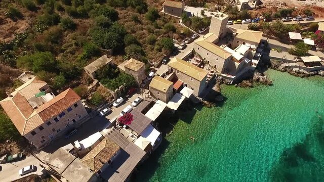 Aerial drone video of picturesque village of Limeni with clear waters, Mani, Peloponnese, Greece