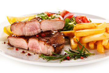 Roast steak with french fries on white background