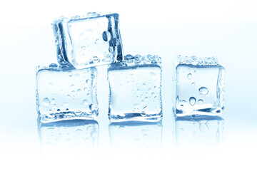 Transparent ice cubes group on white background with water drops