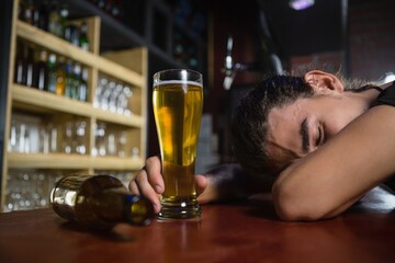 Man sleeping on bar counter
