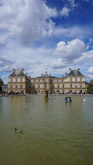 Fototapeta na wymiar Photo of Luxemburg gardens with beutiful clouds on a spring morning, Paris, France