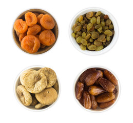 Collage of different dried fruits. Raisins, dates, dried apricots, figs isolated on white background. Top view.