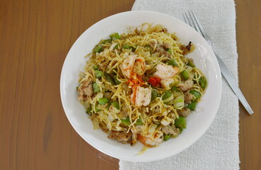 spicy stir fried pepper spaghetti with shrimp and minced pork on plate
