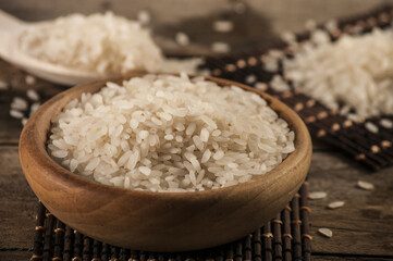 rice, jasmine rice, mali rice in Ladle and basket on the wood background