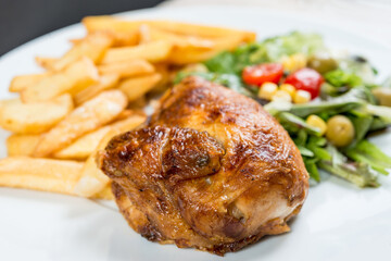 fried chicken and golden French fries potatoes