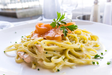 tasty pasta with salmon on a the table