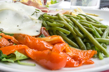 Fresh salad - Delicious fresh salad with tomatoes, lettuce, eggplant, zucchini, cheese, parma ham and olive oil.