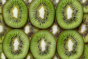 Sliced pieces of kiwi background texture
