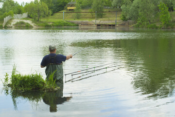 Fototapeta na wymiar Man is fishing on the lake