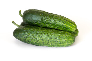 Pile of fresh cucumbers isolated on white background