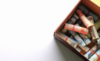 save money concept. Thai money in old paper box on white background. over light