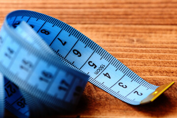 Tape for measuring in blue color with black numbers