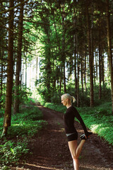 Warm-up of woman in forest