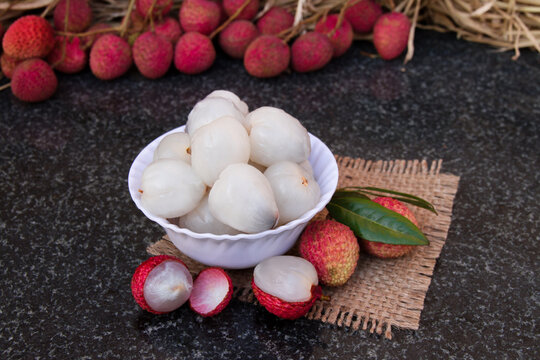 Litchi fruits. Fresh juicy lychee fruit on a glass plate. Peeled lychee fruit.