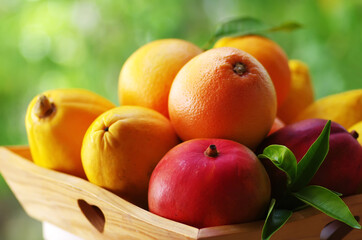 fresh various fruits on wooden basket