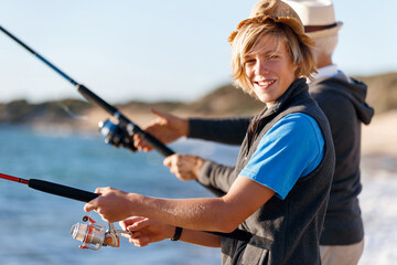 Senior man fishing with his grandson