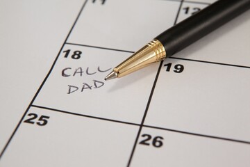 Pen on calender with text