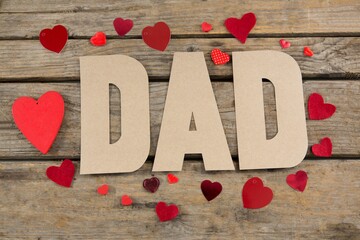 High angle view of dad text with heart shapes