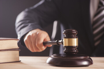 Gavel in the hand of a man in a business suit