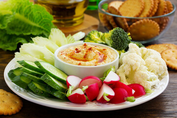 homemade hummus with raw vegetables.