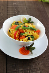 Boiled rice in water with turmeric