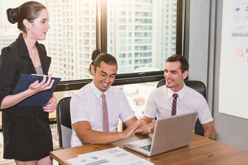 Group of business people happy creative team talking in modern office .Business team sharing their ideas.Happy smiling and laughing