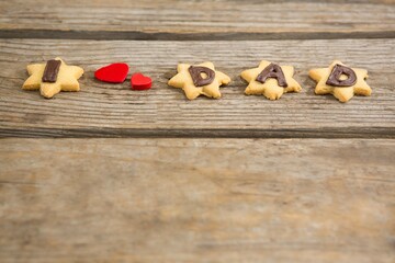 Close up of cookies with text and heart shapes on table