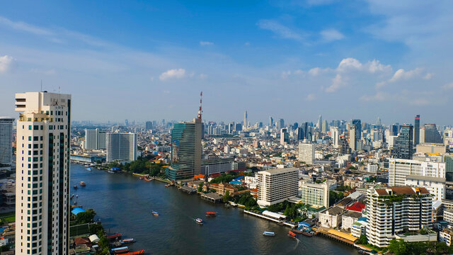 Bangkok skyline with Chao Phraya river at day time.