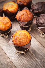 Chocolate muffins on wooden table