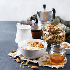 Breakfast with black coffee muesli granola honey nuts milk