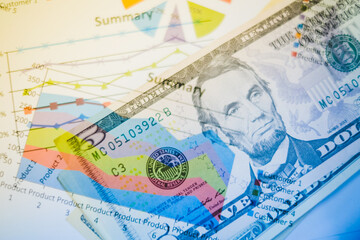 Fototapeta na wymiar Double exposure of graph and dollars banknotes