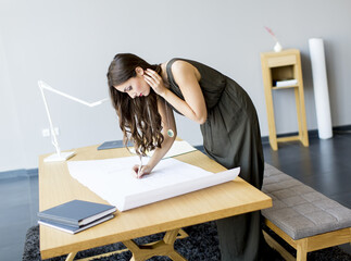 Young architect working on project