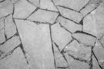 Obraz premium Natural background. Texture of a stone wall or a cracked rock, on the whole frame. Horizontal frame