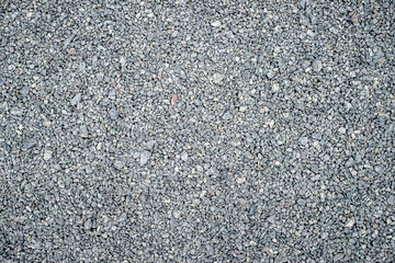 Natural background. Texture of fine gray gravel, on the whole frame. Horizontal frame