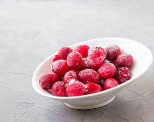 Fototapeta na wymiar Frozen Cranberries in a Bowl