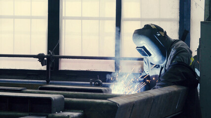 Welder at work in metal industry