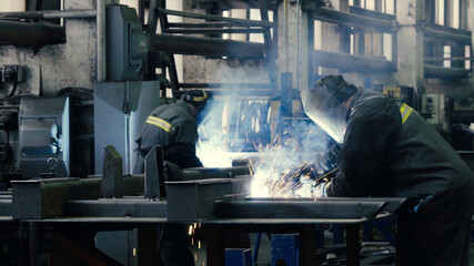 Welder at work in metal industry