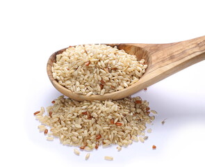 Integral, brown rice and wooden spoon isolated on white background