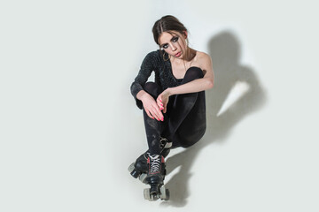 woman on rollers with fashionable makeup and long brunette hair