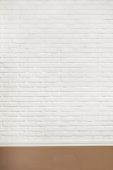 white brick wall with tiled floor, abstract background photo