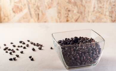 Fototapeta na wymiar Coffee beans scattered on the table,