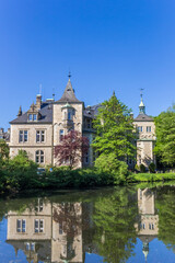 Fototapeta na wymiar Towers of Castle Buckeburg with reflection in the water
