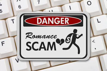 Romance Scam danger sign on a keyboard