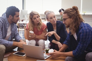 Young business colleagues working together at office