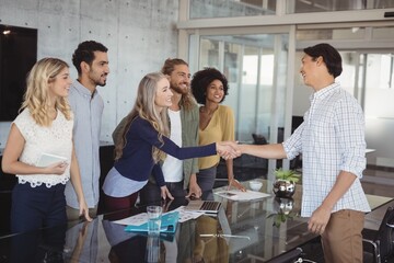 Business people shaking hand at creative office